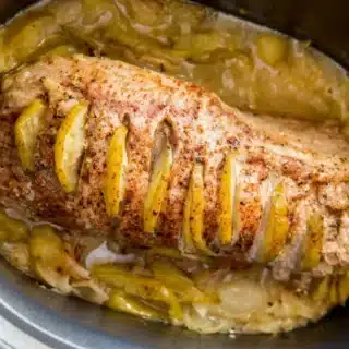 pork slow cooking in a crock pot