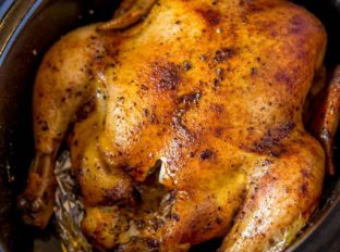 Slow Cooker Rotisserie Chicken made with just a few spices and in the slow cooker with CRISPY skin without a second spent in the oven!