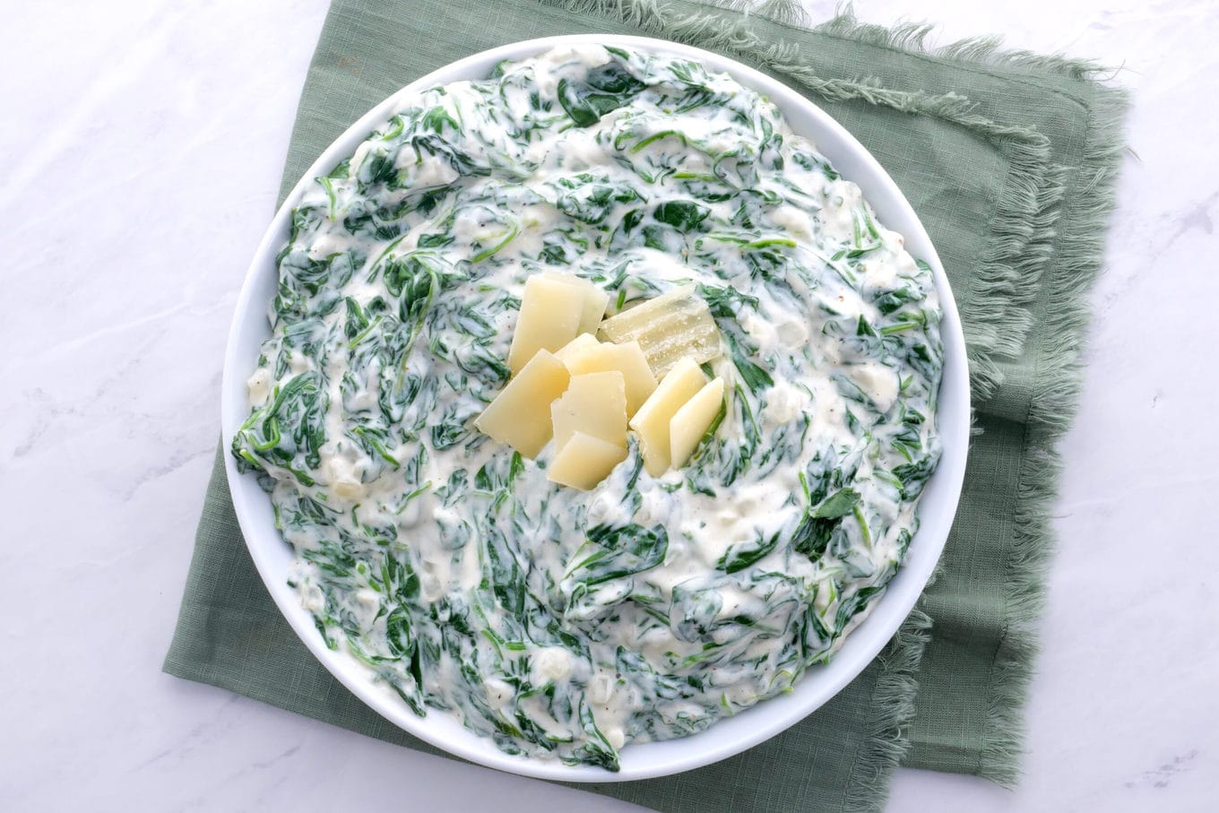 Morton's Steakhouse Creamed Spinach in bowl with parmesan garnish