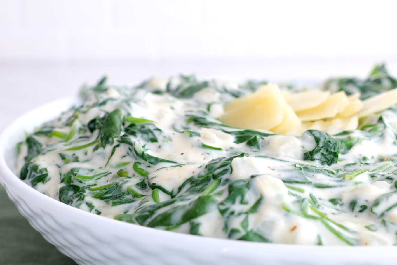 Morton's Steakhouse Creamed Spinach in bowl with parmesan garnish