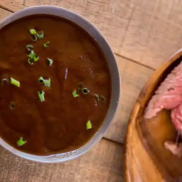 sauce in a bowl with steak on the side