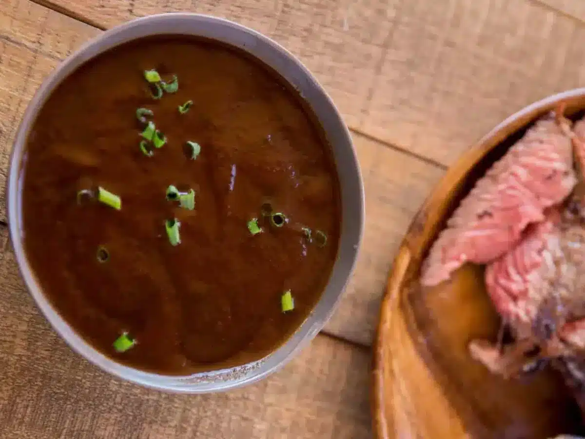 sauce in a bowl with steak on the side