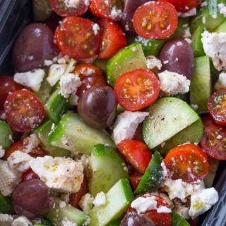 Easy Greek Salad with cucumbers, grape tomatoes, feta cheese and kalamata olives with a lemony red wine vinaigrette dressing in just five minutes.