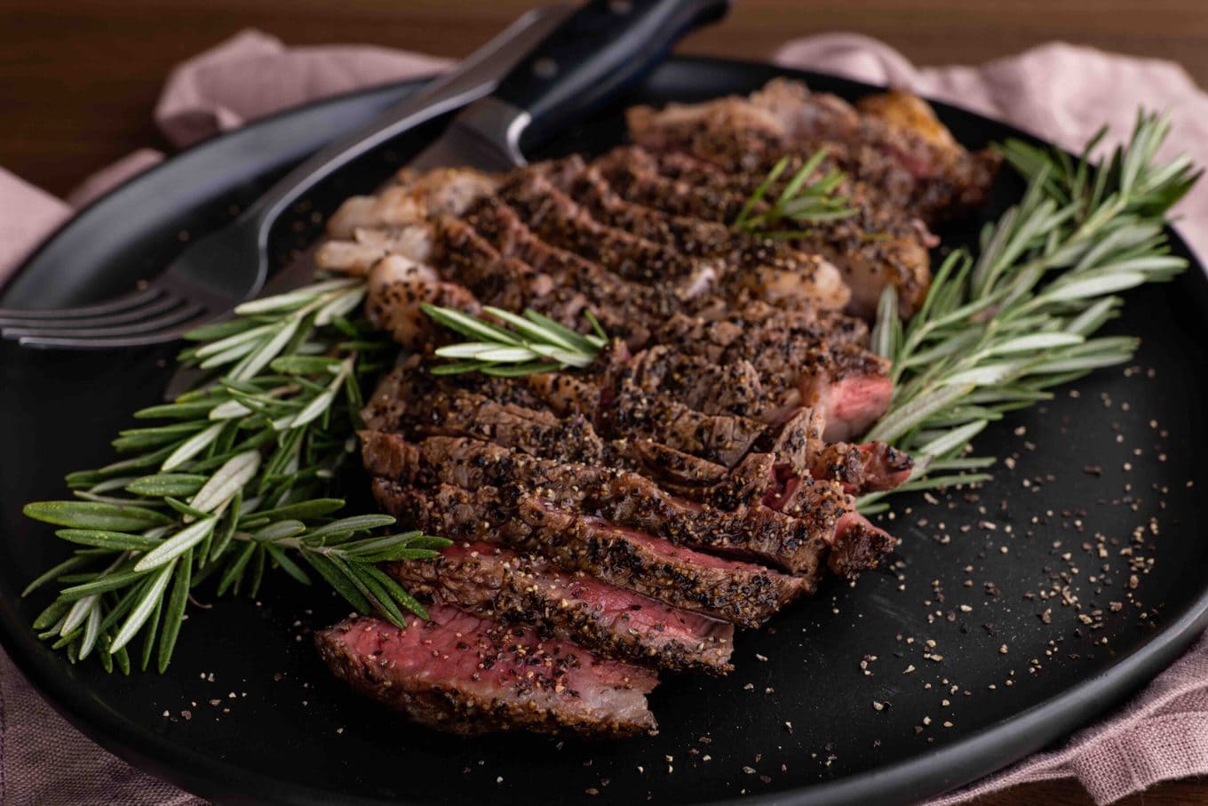 Ribeye Steak sliced on serving platter