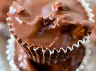 Slow Cooker Chocolate Peanut Candy made with just four ingredients is a perfectly easy holiday recipe that will make gifting even easier!