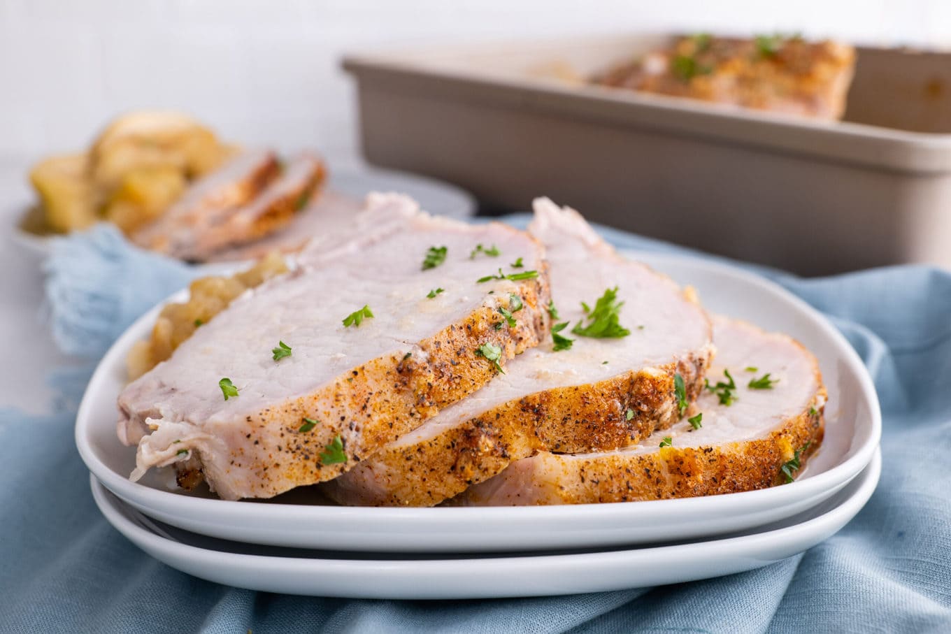 Ultimate Garlic Pork Loin Roast sliced on plate