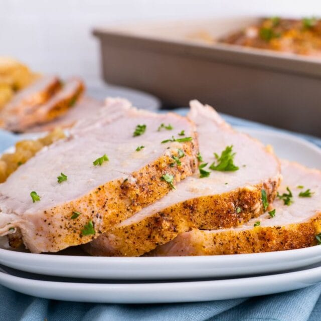 Sliced Pork loin on white plates