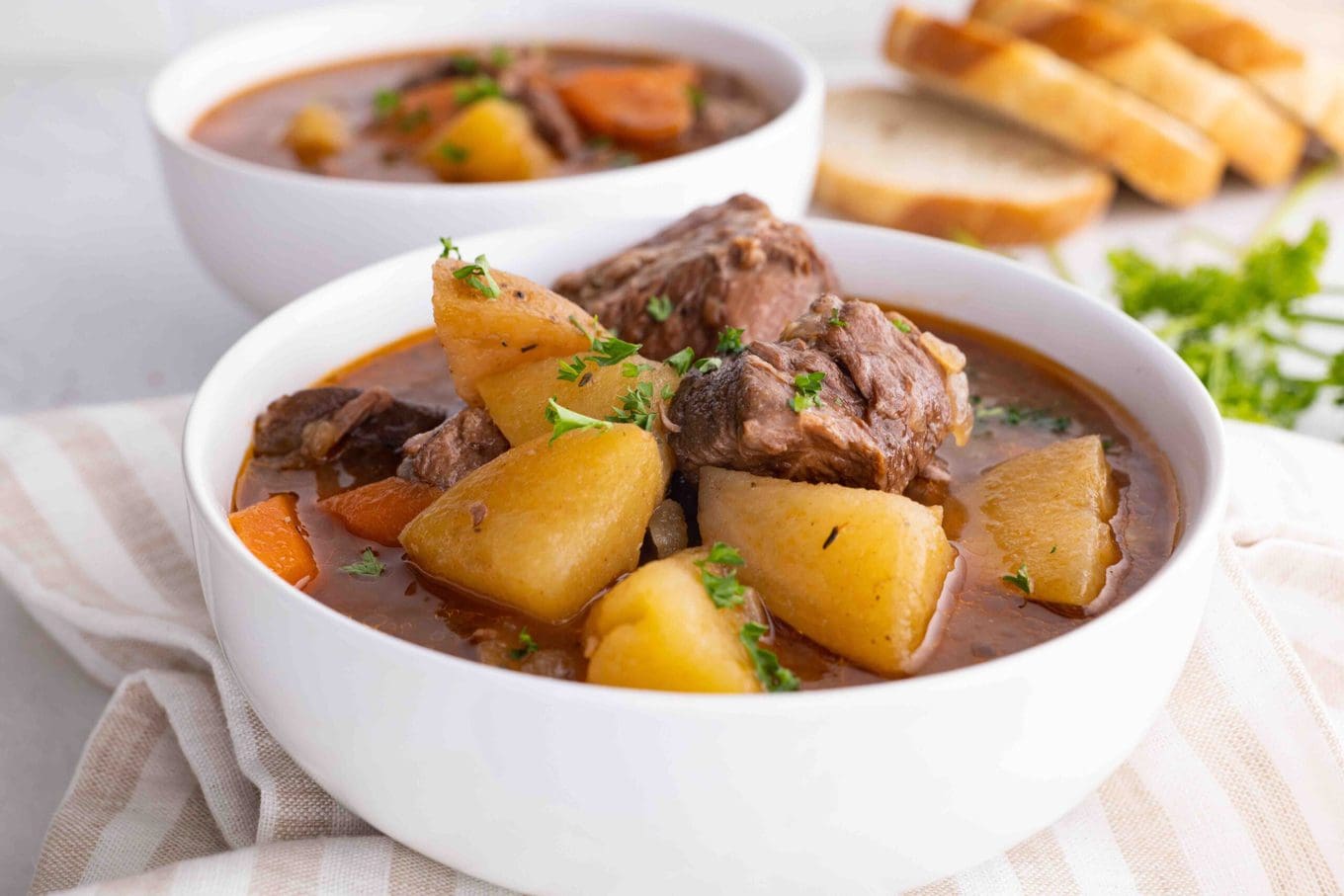 Ultimate Slow Cooker Beef Stew in bowl with parsley garnish