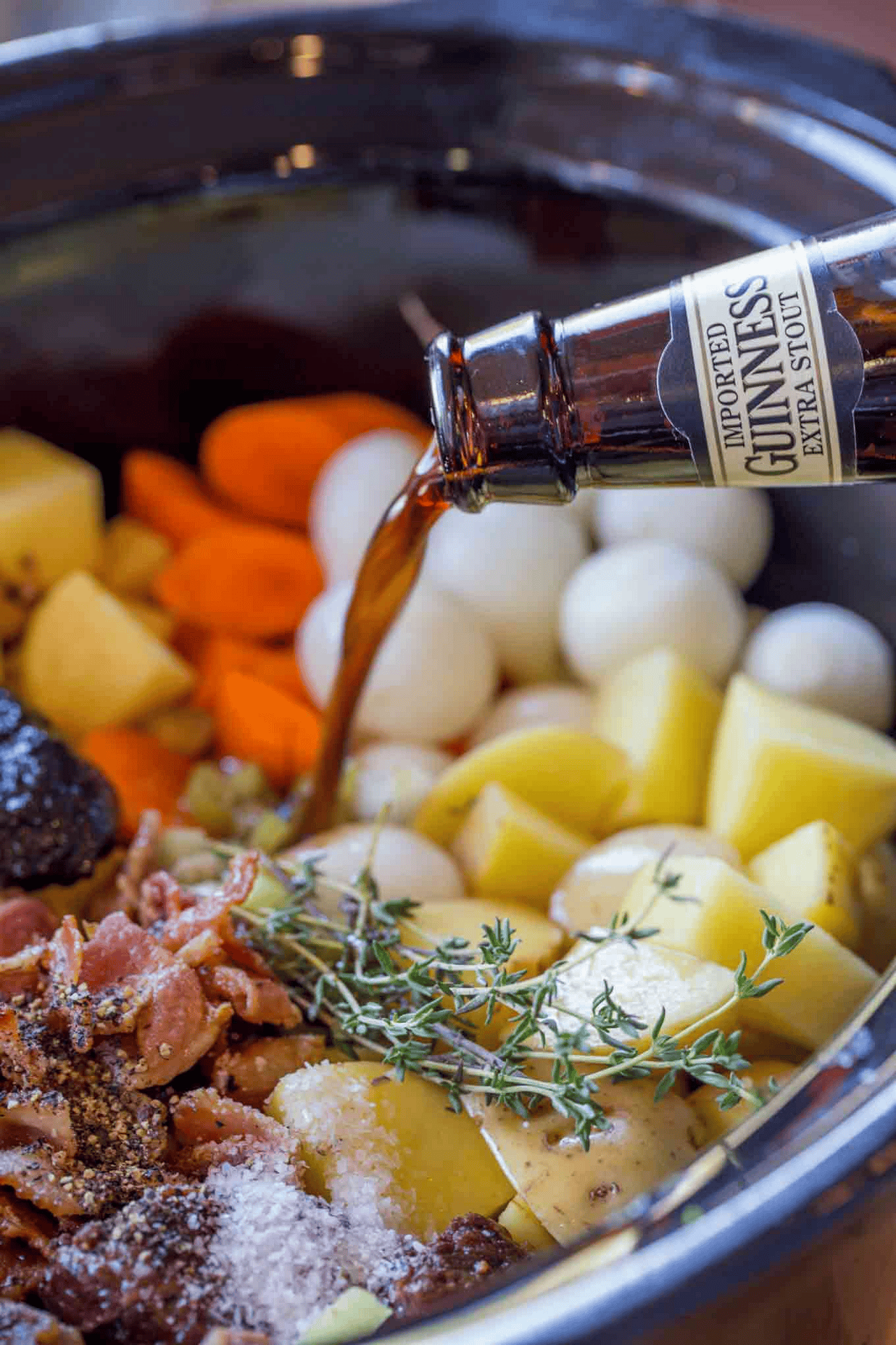 Pouring Guinness into uncooked stew