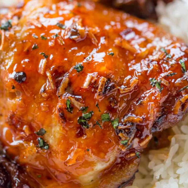 baked chicken on bed of rice