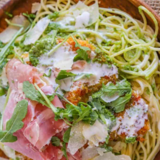 Cooked pasta and ingredients in a bowl