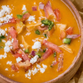 Soup in bowl ready to serve with chips