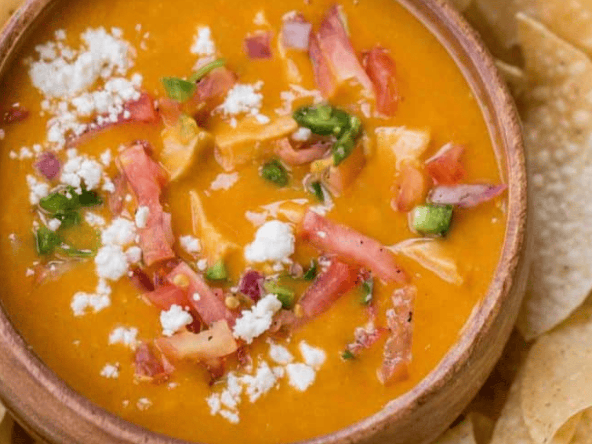Soup in bowl ready to serve with chips