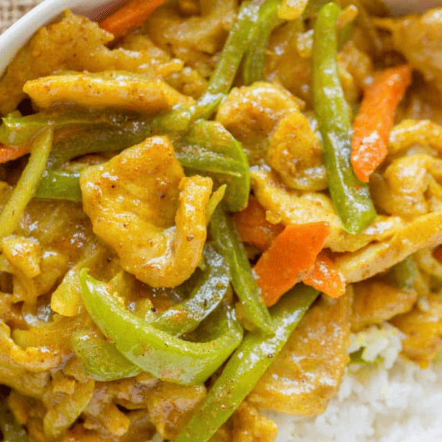 Curry chicken with veggies served over rice