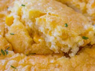 Corn Casserole being scooped.