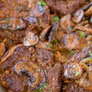 Close up of cooked hamburger steaks in mushroom gravy