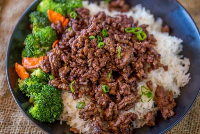 Ground Mongolian Beef in bowl with broccoli, carrots and rice.