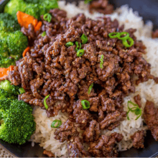 Beef and veggies over rice in blue bowl