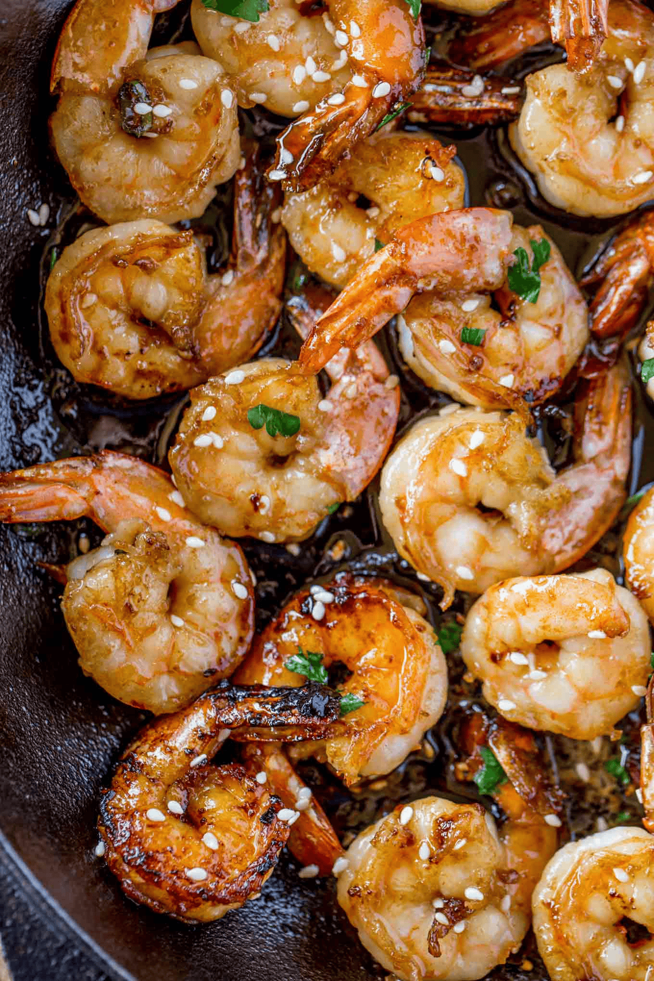 Cooked shrimp topped in white sesame seeds
