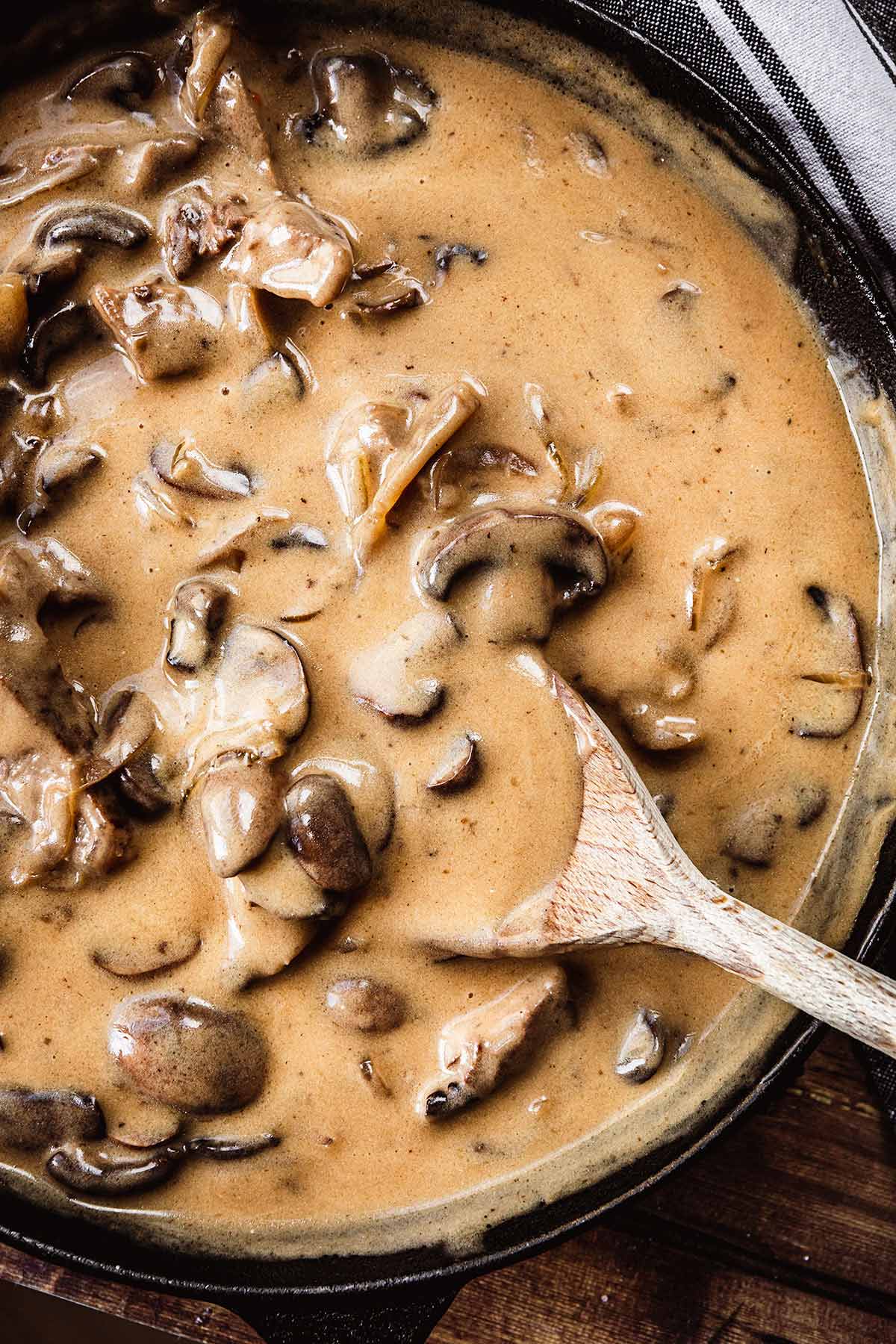Beef Stroganoff onions and mushrooms with creamy gravy in skillet