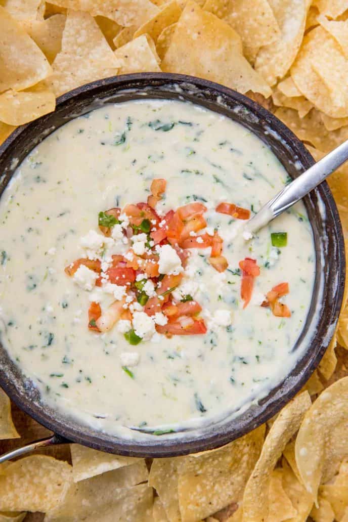 White Spinach Queso in pan with chips