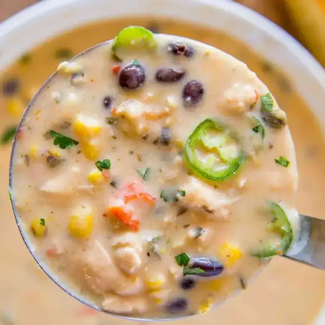 Closeup of spoonful of cooked ingredients