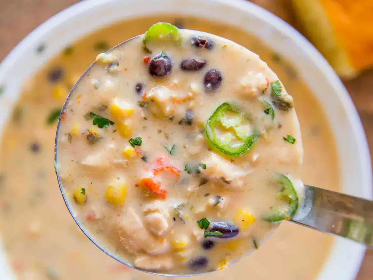 Closeup of spoonful of cooked ingredients