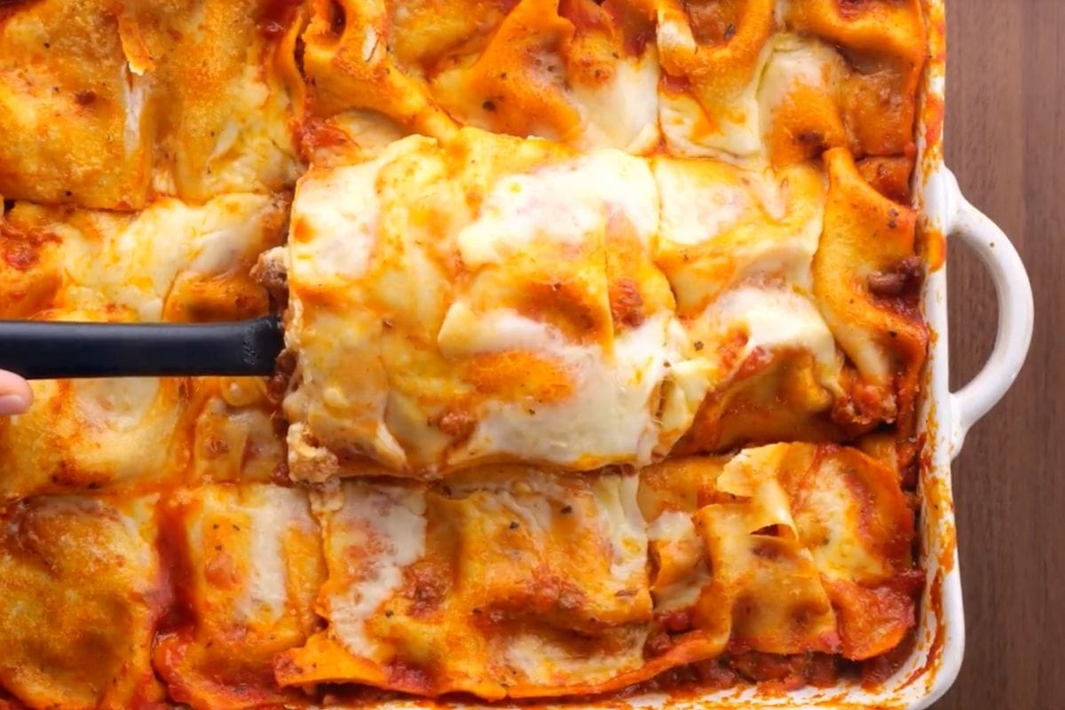 Ultimate Meat Lasagna sliced in baking dish