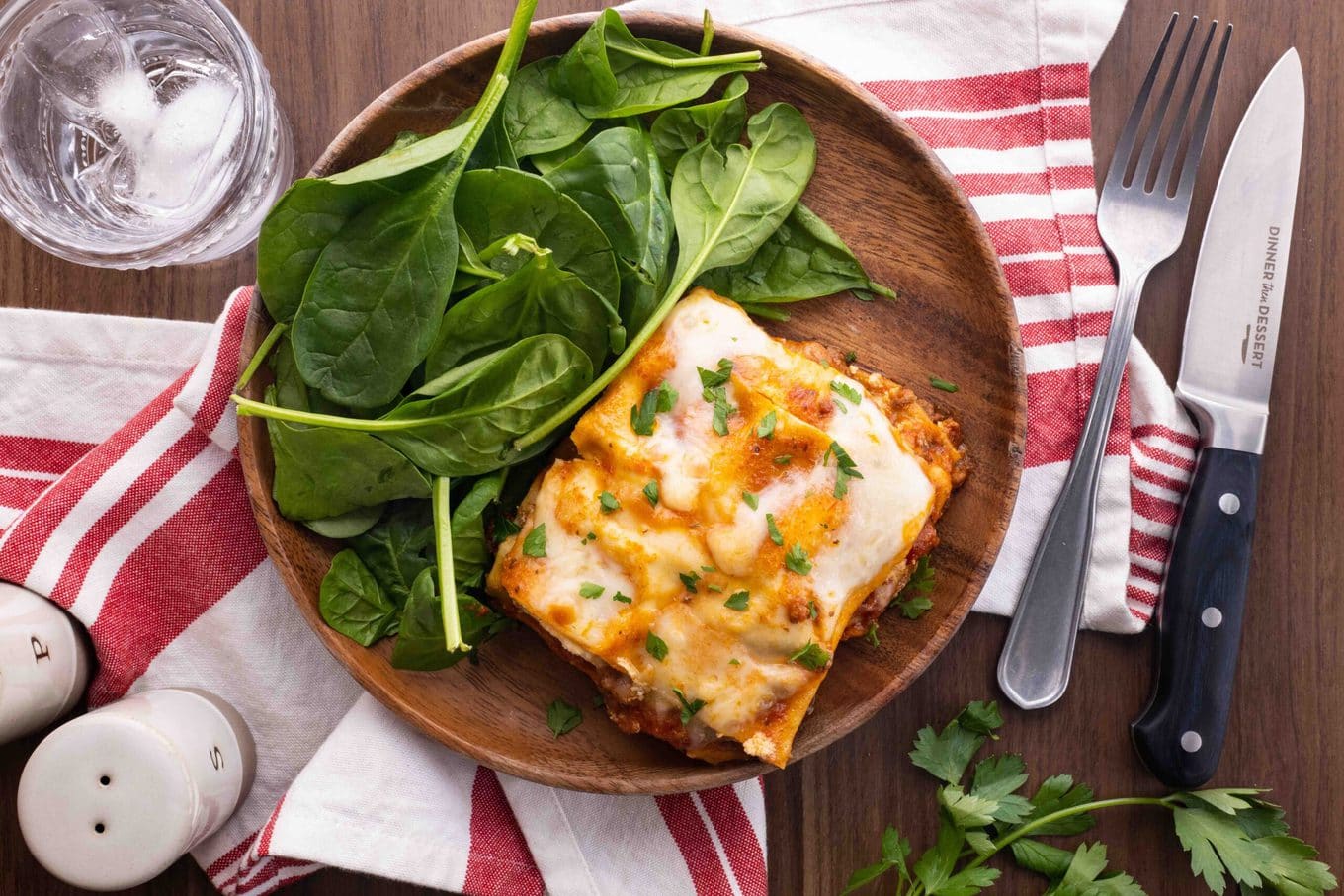 Ultimate Meat Lasagna slice on plate with salad