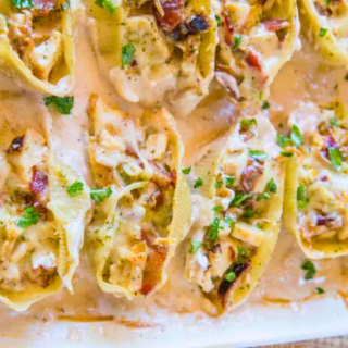 Pan full of stuffed shells in sauce