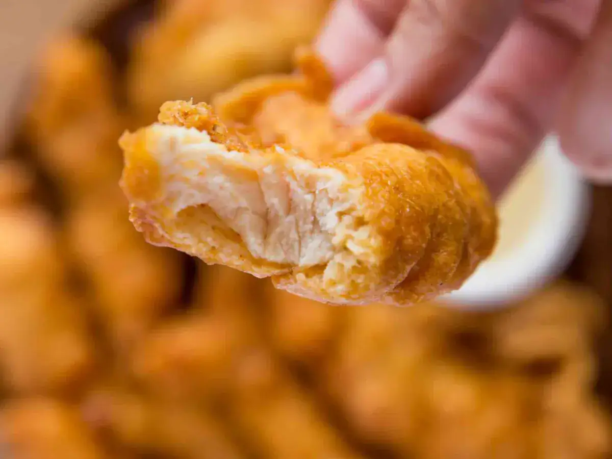a bite taken out of a chicken tender