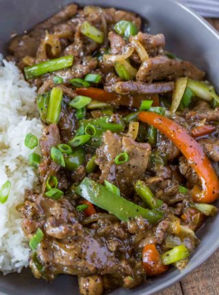 Chinese Pepper Steak in bowl with rice