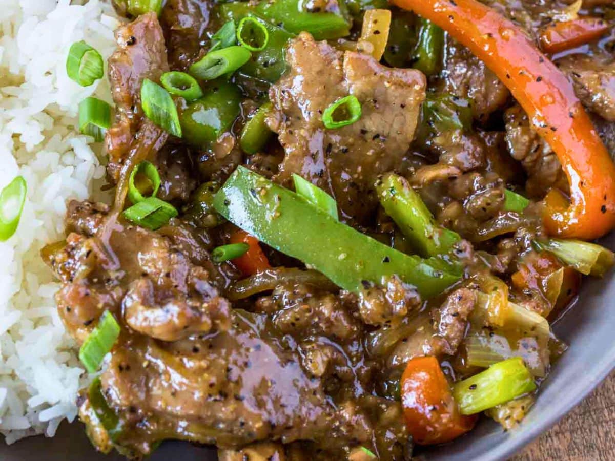 Pepper steak served with rice in a bowl