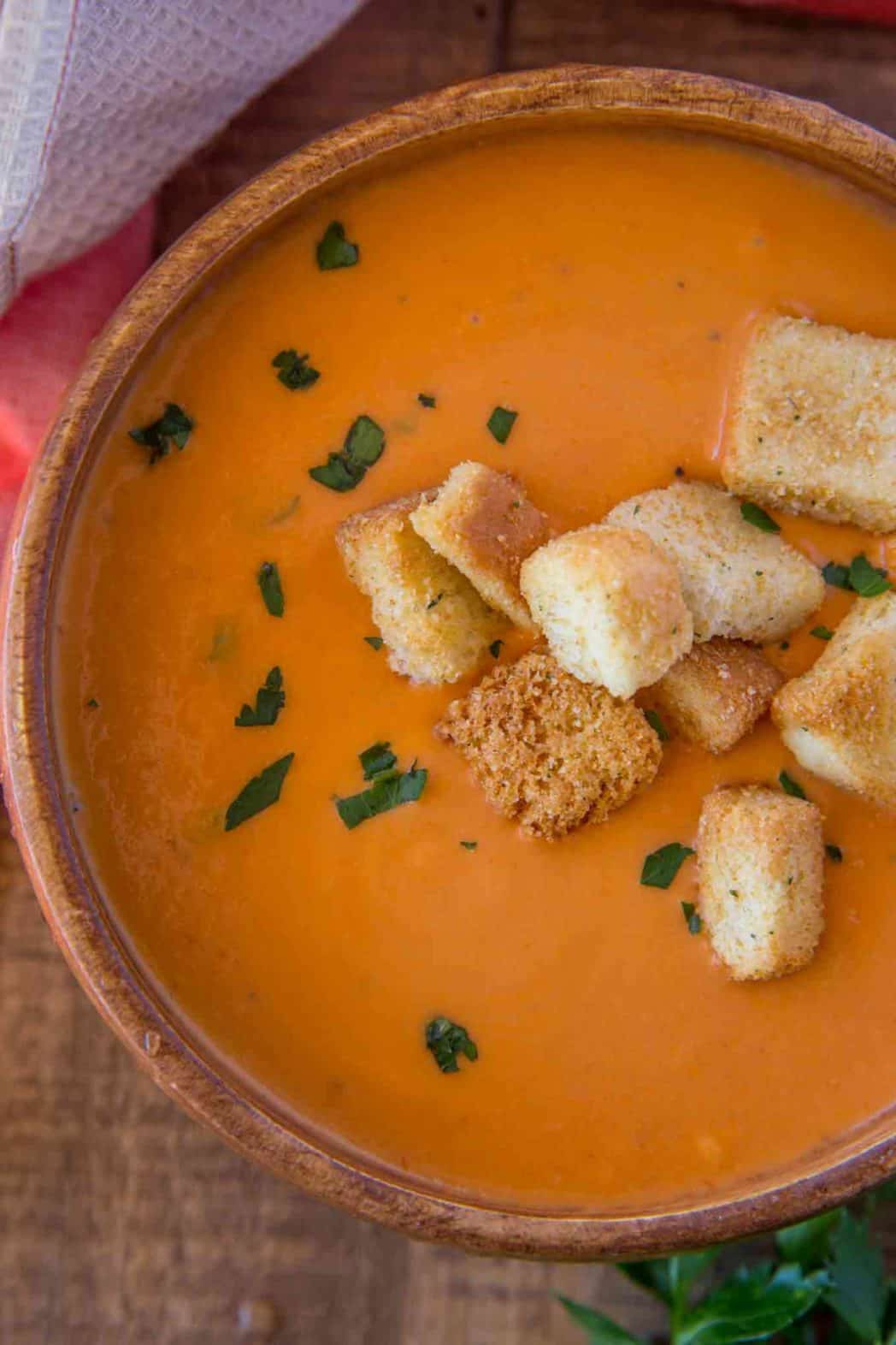 creamy easy tomato soup in wooden bowl