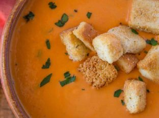 creamy easy tomato soup in wooden bowl