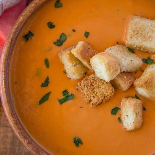 creamy easy tomato soup in wooden bowl