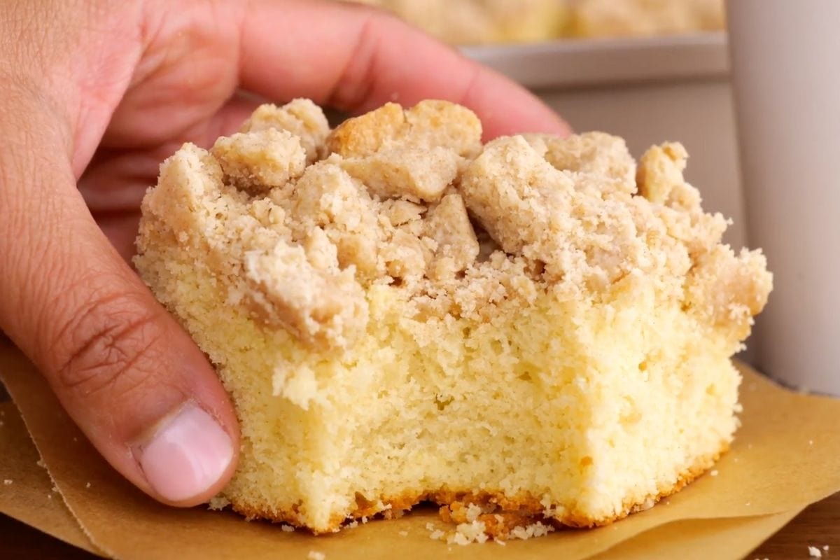 New York Crumb Cake piece with bite taken