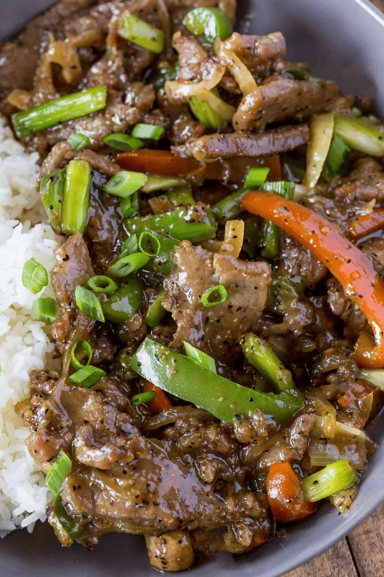 Chinese steak served with rice in a bowl