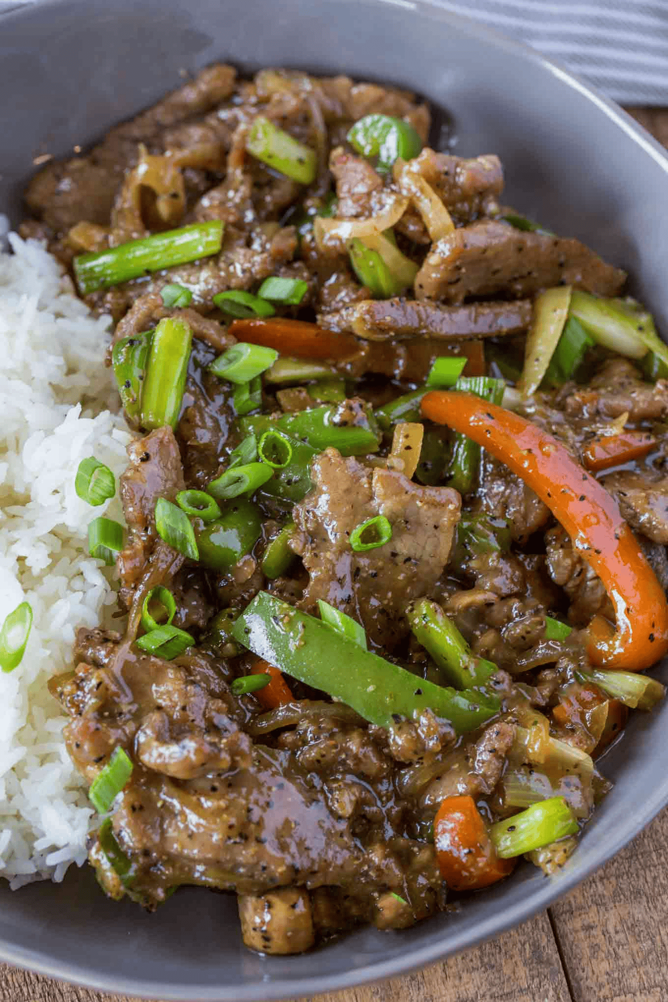 Steak and peppers served with rice