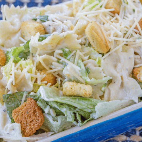 Lettuce, pasta, and dressing ready to serve