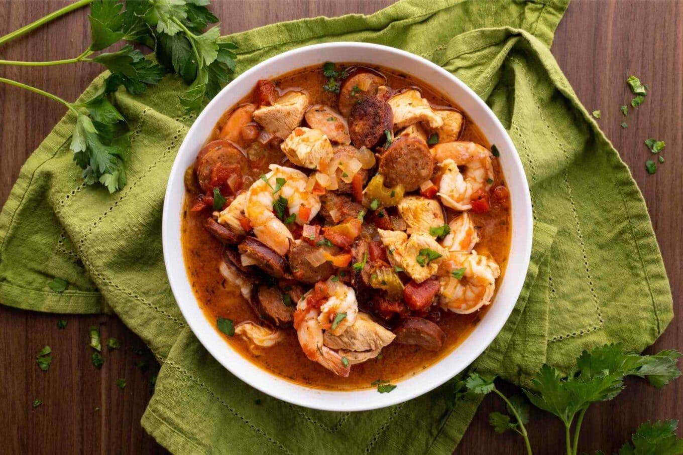 Bowl of jambalaya on a green cloth