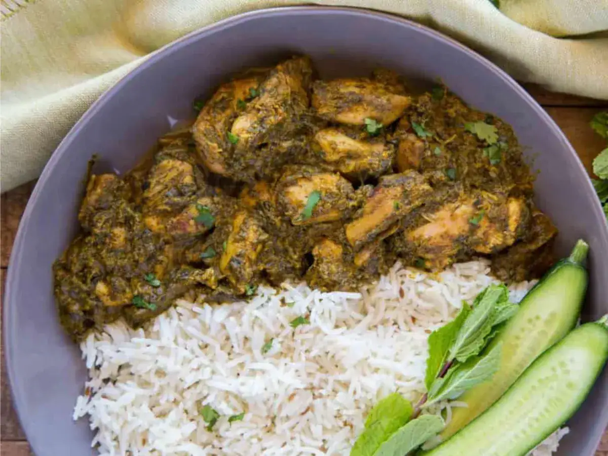 Chicken served on plate with rice