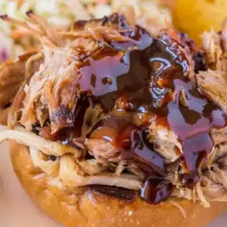 shredded pork with bbq sauce on a bun