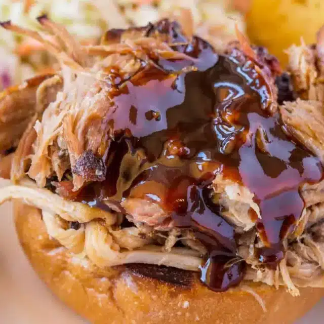shredded pork with bbq sauce on a bun