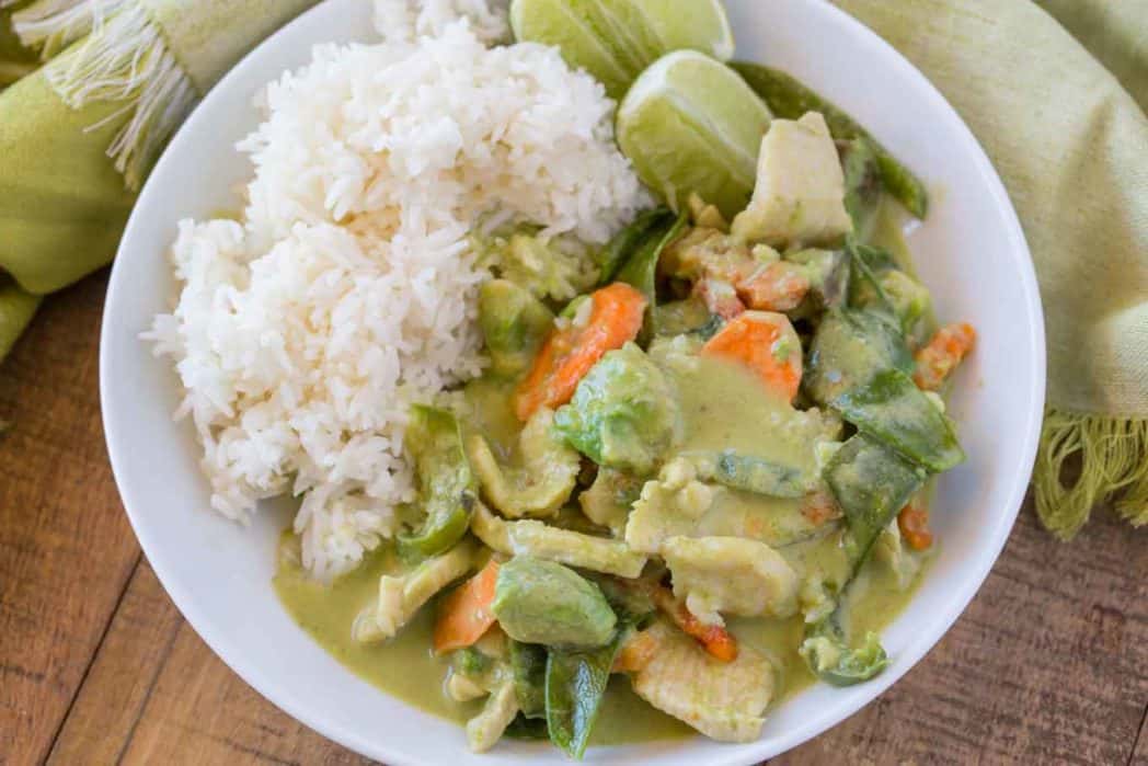 plated curry with rice and limes
