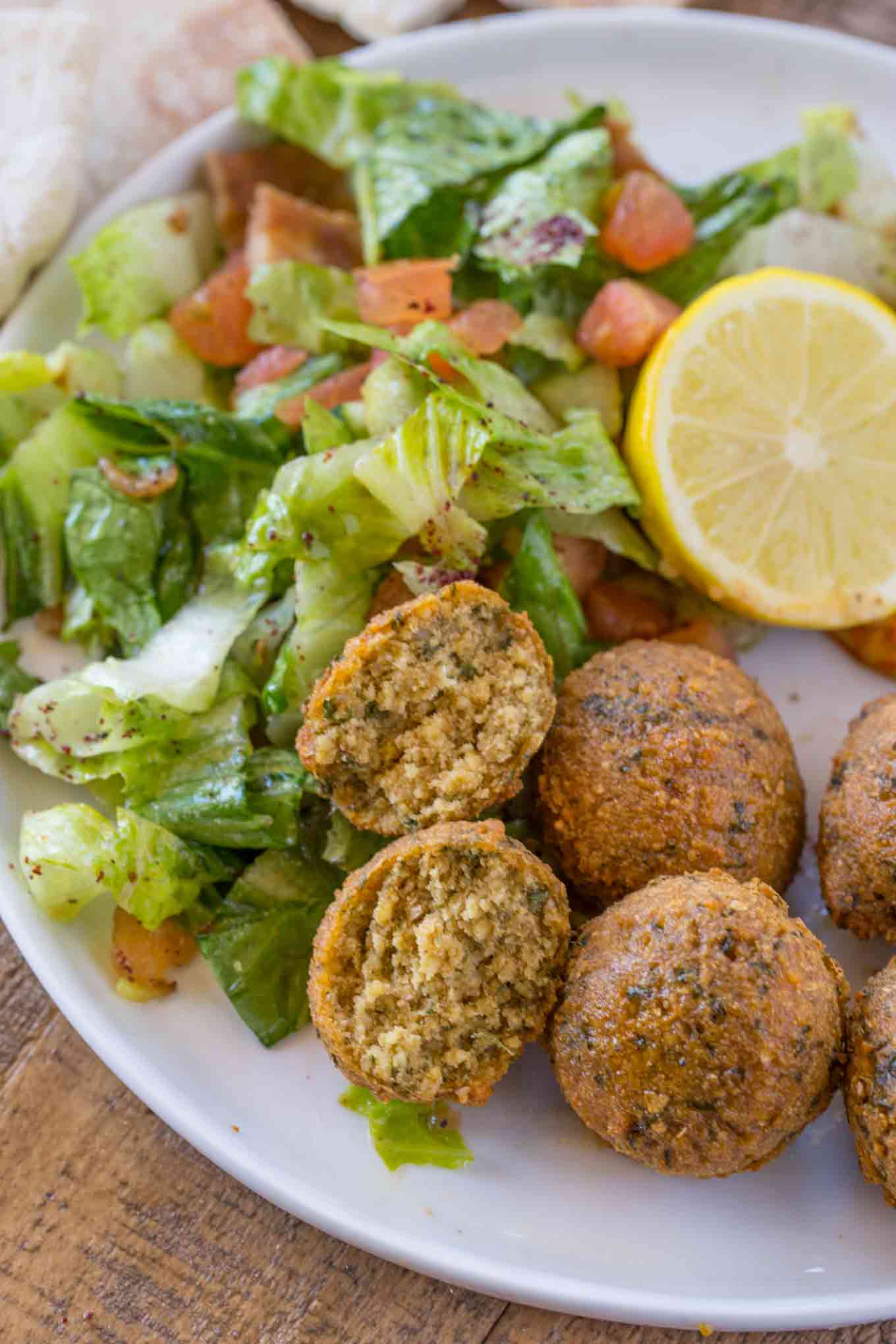 Falafel with one split in half served with lettuce