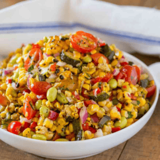 Vegetables mixed with ingredients and seasoning in bowl ready to serve