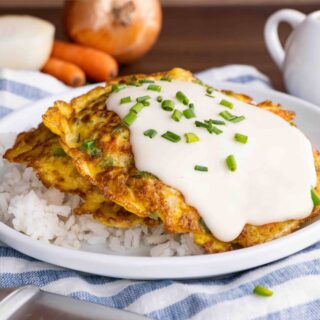 Egg Foo Young with gravy on plate