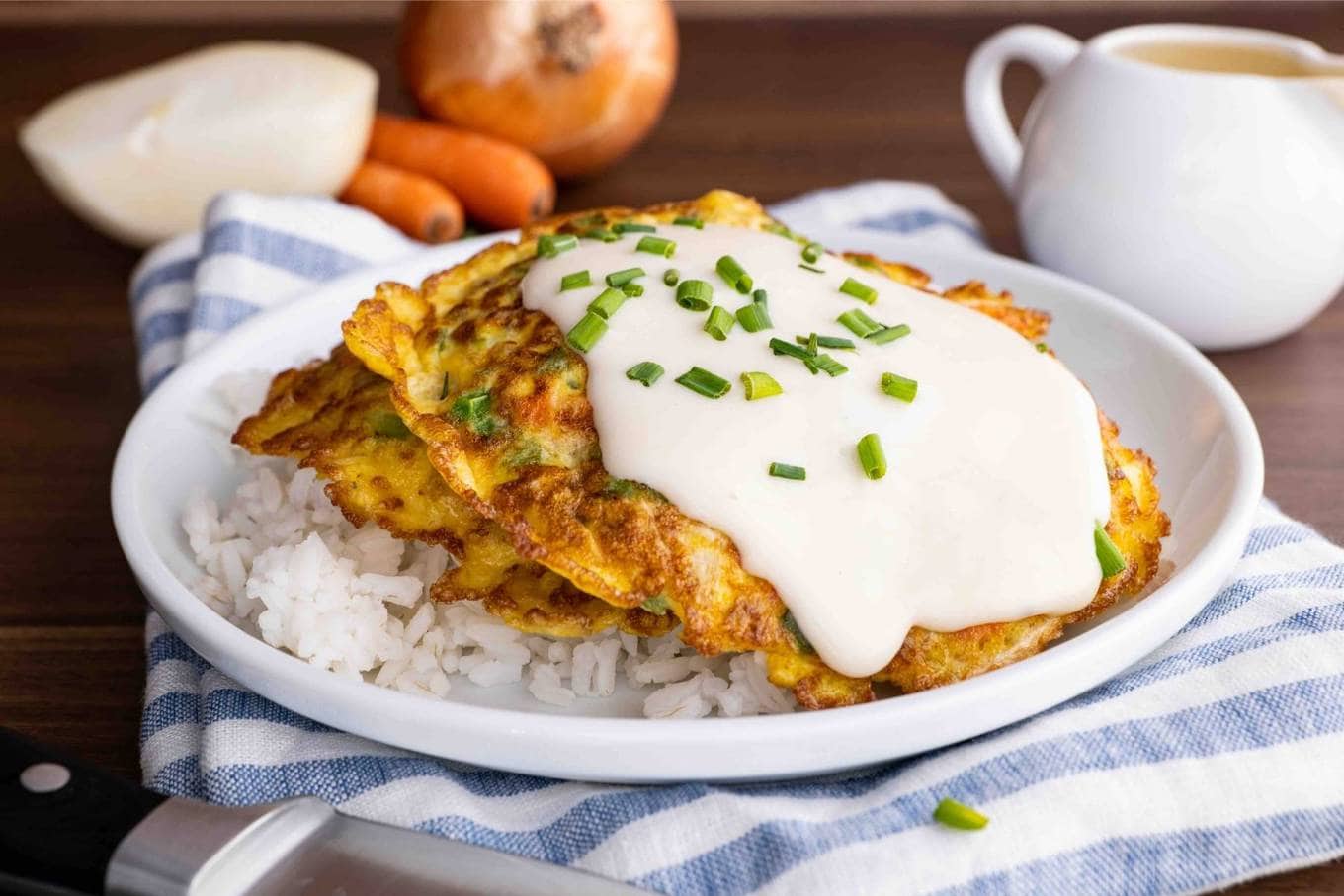 Egg Foo Young with gravy on plate