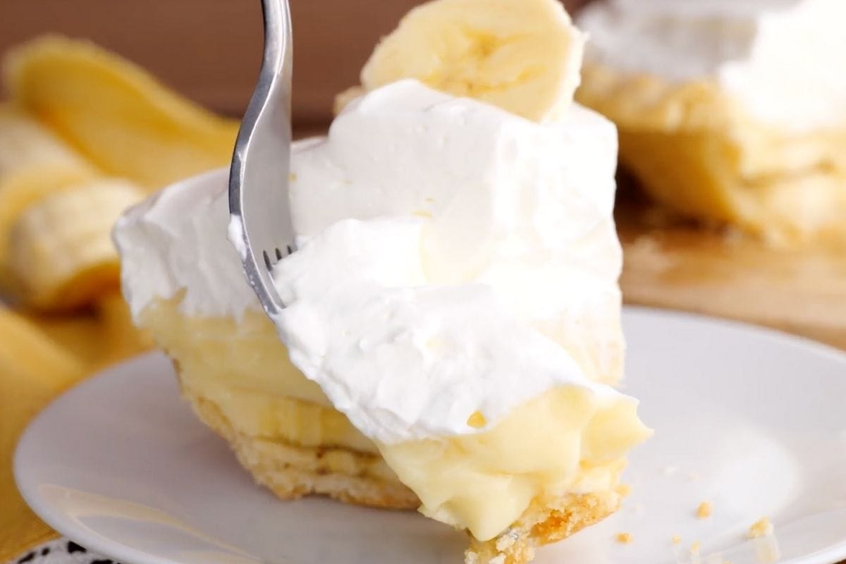 Banana Cream Pie slice on plate with fork